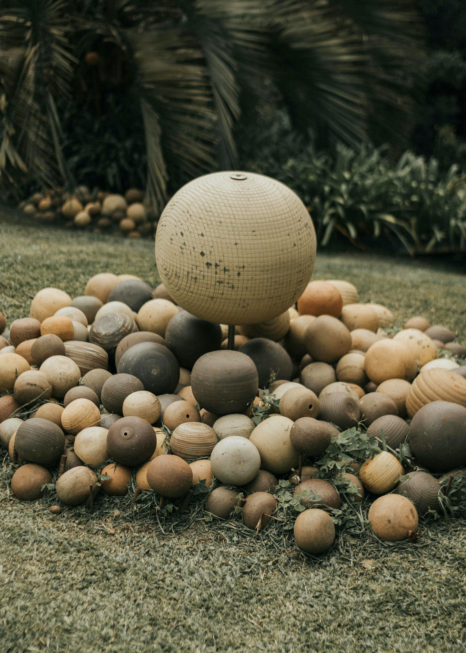 Ultra realistic stone sphere garden composition with calm green landscaping