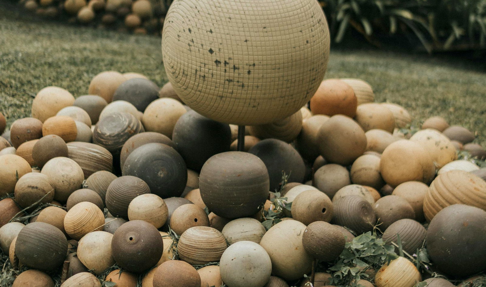 Wide ultra realistic sphere garden arrangement in soft green landscape